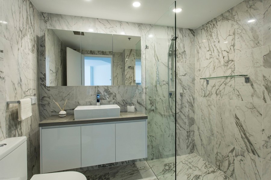 Luxurious marble bathroom with glass shower