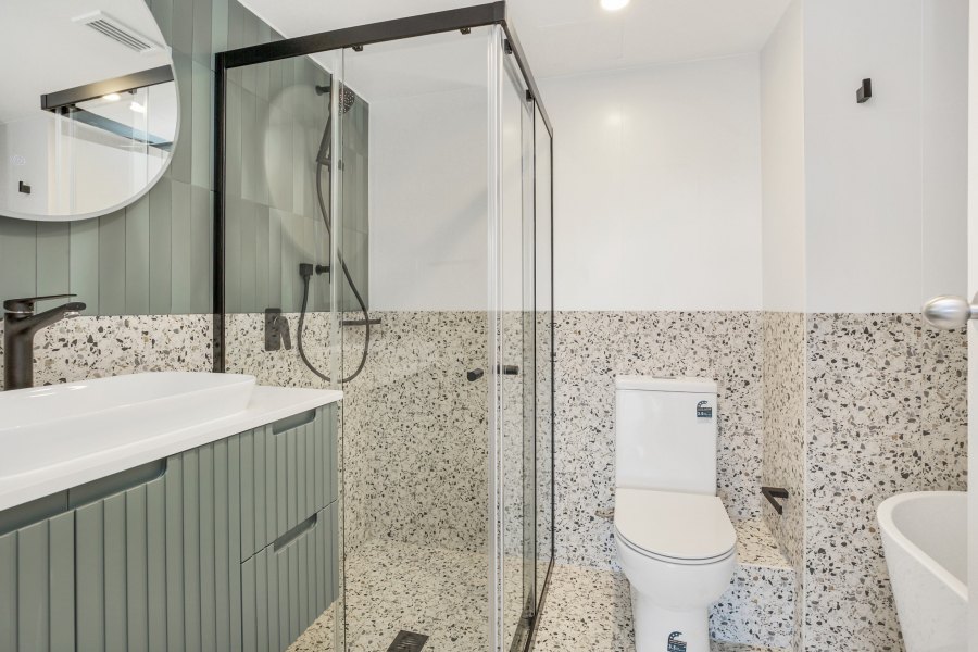 Modern bathroom with terrazzo tiles and shower