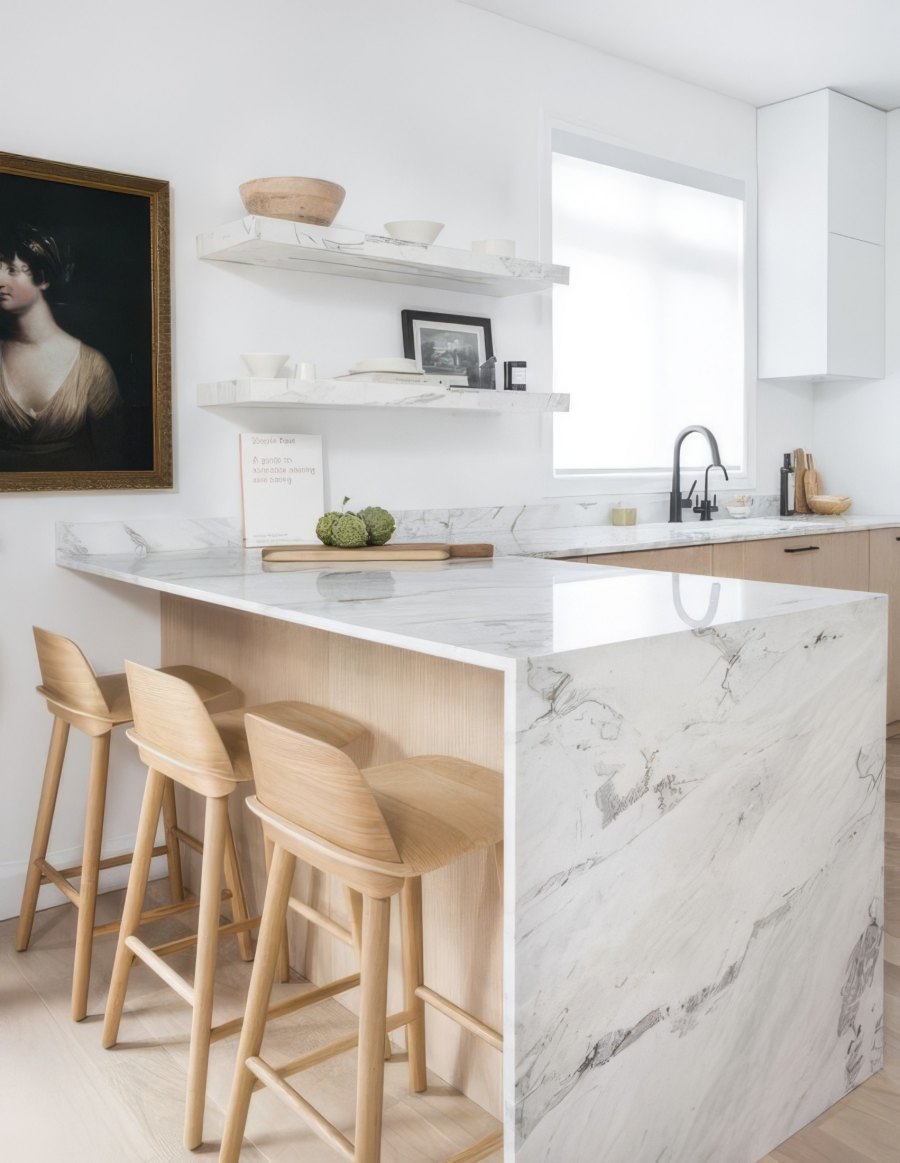 Minimalist kitchen with marble counter and stools