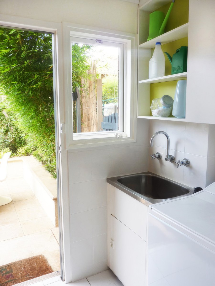 Small laundry area with garden view